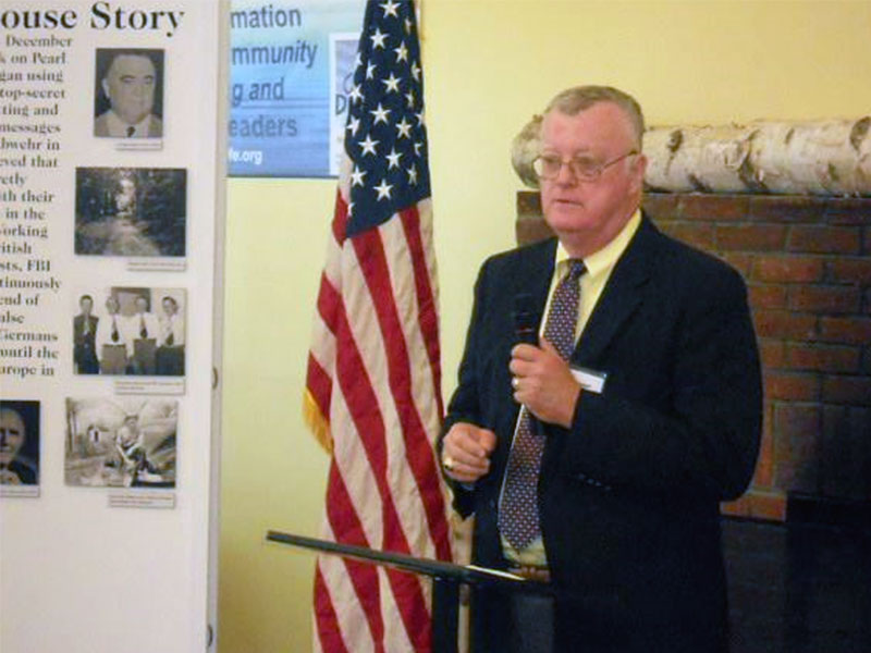 Author and retired FBI Supervisory Special Agent Ray Batvinis speaks at a ceremony at the Benson house.